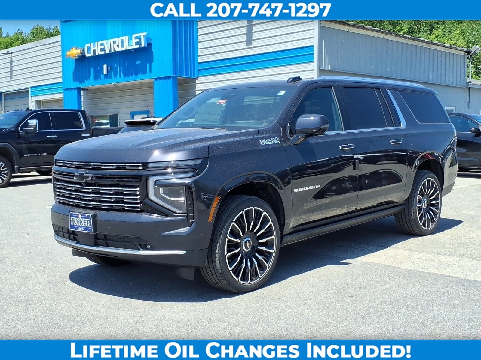 2026 Chevrolet Suburban High Country in Dark Ash Metallic — front three-quarter view