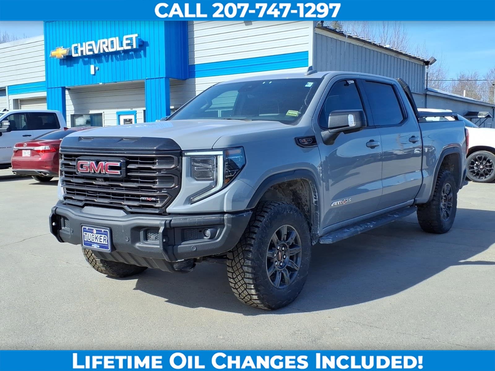 2024 GMC Sierra 1500 AT4X in Thunderstorm Gray — front three-quarter view